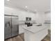 Bright kitchen featuring stainless steel appliances, granite countertops, and ample cabinet space at 1119 W 7Th St, Sanford, FL 32771