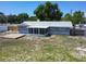 Aerial view of the backyard showing the deck and screened in porch at 11624 Ocklawaha Dr, Leesburg, FL 34788