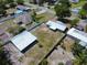 Aerial view of the home, outbuilding, and fenced-in yard at 11624 Ocklawaha Dr, Leesburg, FL 34788