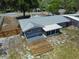 Aerial view of the backyard with the wood deck and screened-in porch at 11624 Ocklawaha Dr, Leesburg, FL 34788
