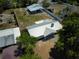 Aerial view of the home, outbuilding, and well maintained yard at 11624 Ocklawaha Dr, Leesburg, FL 34788