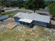 Aerial view of home with wood deck and screened-in porch at 11624 Ocklawaha Dr, Leesburg, FL 34788