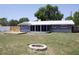 Backyard with a screened-in porch, firepit, and wood deck at 11624 Ocklawaha Dr, Leesburg, FL 34788