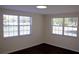 Inviting bedroom featuring neutral walls and two windows, perfect for natural light and ventilation at 11624 Ocklawaha Dr, Leesburg, FL 34788