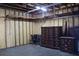 Garage interior with unfinished wood walls, a concrete floor, and furniture storage at 11624 Ocklawaha Dr, Leesburg, FL 34788