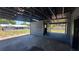 Exterior view of the garage with access to the backyard and main house at 11624 Ocklawaha Dr, Leesburg, FL 34788