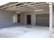 Detached garage and carport featuring a drive-through design and ample parking space at 11624 Ocklawaha Dr, Leesburg, FL 34788