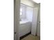 Functional laundry room with washer, dryer, closet and shelving for storage at 11624 Ocklawaha Dr, Leesburg, FL 34788