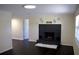 Bright living room with a modern fireplace, dark floors, and recessed lighting at 11624 Ocklawaha Dr, Leesburg, FL 34788