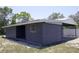 View of outbuilding with covered parking on a grassy lot at 11624 Ocklawaha Dr, Leesburg, FL 34788