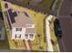 Aerial view of a home with lush landscaping and a brick driveway at 11982 Travel Aly, Orlando, FL 32832