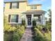 Charming two-story home with manicured landscaping and inviting front porch at 11982 Travel Aly, Orlando, FL 32832
