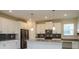 Modern kitchen featuring white cabinets, stainless steel appliances and plenty of counter space at 11982 Travel Aly, Orlando, FL 32832