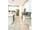Modern kitchen boasts white cabinets, stainless steel appliances, and stylish countertops at 11982 Travel Aly, Orlando, FL 32832