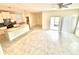 Spacious open concept featuring a kitchen with tile floors and sliding glass doors at 11982 Travel Aly, Orlando, FL 32832