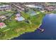 Aerial view of community featuring a pool, clubhouse, playground, pier, and recreational facilities at 1208 Castleport Rd, Winter Garden, FL 34787