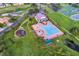 Aerial view of community pool, clubhouse, playground, and surrounding green spaces in a well-maintained neighborhood at 1208 Castleport Rd, Winter Garden, FL 34787