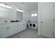 Bright bathroom featuring double sinks, soaking tub and tiled floor at 1208 Castleport Rd, Winter Garden, FL 34787