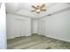 Bedroom featuring wood-look flooring, closet and tray ceiling at 1208 Castleport Rd, Winter Garden, FL 34787