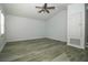 Bedroom featuring vaulted ceilings, plantation shutters, and vinyl plank flooring at 1208 Castleport Rd, Winter Garden, FL 34787