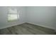Bedroom featuring luxury vinyl plank flooring and a window with blinds at 1208 Castleport Rd, Winter Garden, FL 34787