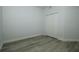 Bedroom featuring luxury vinyl plank flooring and a closet with doors at 1208 Castleport Rd, Winter Garden, FL 34787