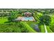 Community pool, clubhouse, and playground with lush landscaping, offering a picturesque recreational area at 1208 Castleport Rd, Winter Garden, FL 34787