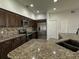 Stylish kitchen showcasing granite countertops, stainless steel appliances, and ample cabinet space at 1208 Castleport Rd, Winter Garden, FL 34787