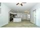 Open-concept kitchen and living room featuring stainless steel appliances and a breakfast bar at 1208 Castleport Rd, Winter Garden, FL 34787