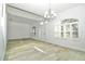 Spacious living room with arched windows, ample natural light, and new floors at 1208 Castleport Rd, Winter Garden, FL 34787