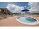 Community splash pad and pool area featuring a kiddie pool, chairs, and a large sun deck at 1208 Castleport Rd, Winter Garden, FL 34787