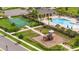 Aerial view of community amenities including a pool, playground and sport court at 12259 Bracco St, Winter Garden, FL 34787