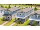 Modern two-story homes with manicured lawns and inviting front porches at 12259 Bracco St, Winter Garden, FL 34787