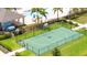Outdoor community basketball court with lush green grass and view of community pool at 12259 Bracco St, Winter Garden, FL 34787