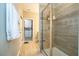 Bright bathroom featuring tiled shower with glass door and open access to walk-in closet at 12259 Bracco St, Winter Garden, FL 34787