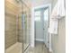Elegant bathroom featuring a glass shower with decorative tile work at 12259 Bracco St, Winter Garden, FL 34787