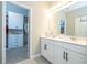 Clean bathroom with double vanity, undermount sinks, and access to a walk-in closet at 12259 Bracco St, Winter Garden, FL 34787