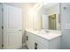 Bright bathroom with double sinks, vanity, and neutral color scheme at 12259 Bracco St, Winter Garden, FL 34787