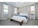 Comfortable bedroom features neutral colors, lots of natural light, and contemporary furnishings at 12259 Bracco St, Winter Garden, FL 34787