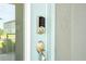 Smart lock system installed on a light blue front door with glass panel at 12259 Bracco St, Winter Garden, FL 34787