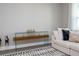 Elegant living room with a glass console table, accent decor, and plush seating at 12259 Bracco St, Winter Garden, FL 34787