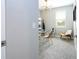 Bright, carpeted office featuring a modern light fixture and glass desk at 12259 Bracco St, Winter Garden, FL 34787