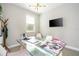 Home office featuring a glass desk, mounted TV, and window views at 12259 Bracco St, Winter Garden, FL 34787