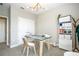 Office features a glass desk, storage unit and an exterior view at 12259 Bracco St, Winter Garden, FL 34787