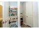 Well-organized pantry with wire shelves, stocked with an assortment of food items and supplies at 12259 Bracco St, Winter Garden, FL 34787