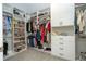 Large, well-organized walk-in closet with built-in shelving and ample storage space at 12259 Bracco St, Winter Garden, FL 34787