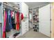 Spacious walk-in closet featuring custom shelving and organized storage solutions at 12259 Bracco St, Winter Garden, FL 34787