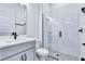 Modern bathroom featuring a glass shower with white tiling and gray and white tile flooring at 13075 Sunrise Harvest Dr, Winter Garden, FL 34787