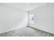 Minimalist bedroom with plush carpeting and a window providing natural light at 13075 Sunrise Harvest Dr, Winter Garden, FL 34787