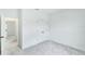 Bright bedroom featuring a closet, doorway, and plush carpeting at 13075 Sunrise Harvest Dr, Winter Garden, FL 34787